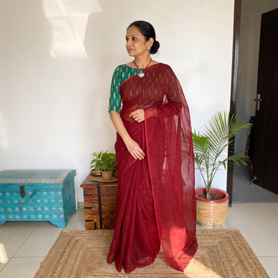 Red Nazaakat Kota Doria Cotton Plain Saree with Blouse & Jewellery Set, draped and worn by a woman, AI visual of the saree, iTokri