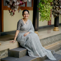 Grey Nazaakat Kota Doria Cotton Plain Saree with Blouse & Jewellery Set, draped and worn by a woman, AI visual of the saree, iTokri