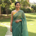 Green Nazaakat Kota Doria Cotton Plain Saree with Blouse & Jewellery Set, draped and worn by a woman, AI visual of the saree, iTokri
