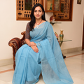 Blue Nazaakat Kota Doria Cotton Plain Saree with Blouse & Jewellery Set, draped and worn by a woman, AI visual of the saree, iTokri