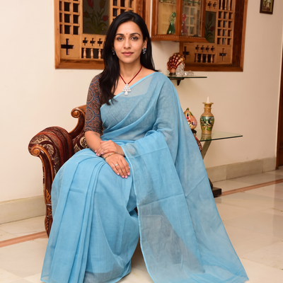 Blue Nazaakat Kota Doria Cotton Plain Saree with Blouse & Jewellery Set, draped and worn by a woman, AI visual of the saree, iTokri