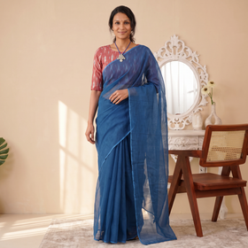 Blue Nazaakat Kota Doria Cotton Plain Saree with Blouse & Jewellery Set, draped and worn by a woman, AI visual of the saree, iTokri