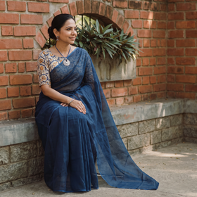 Blue Nazaakat Kota Doria Cotton Plain Saree with Blouse & Jewellery Set, draped and worn by a woman, AI visual of the saree, iTokri
