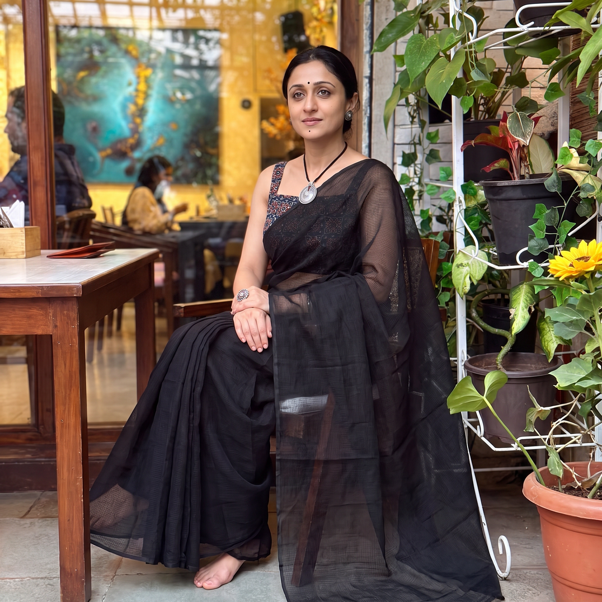 Black Nazaakat Kota Doria Cotton Plain Saree with Blouse & Jewellery Set, draped and worn by a woman, AI visual of the saree, iTokri