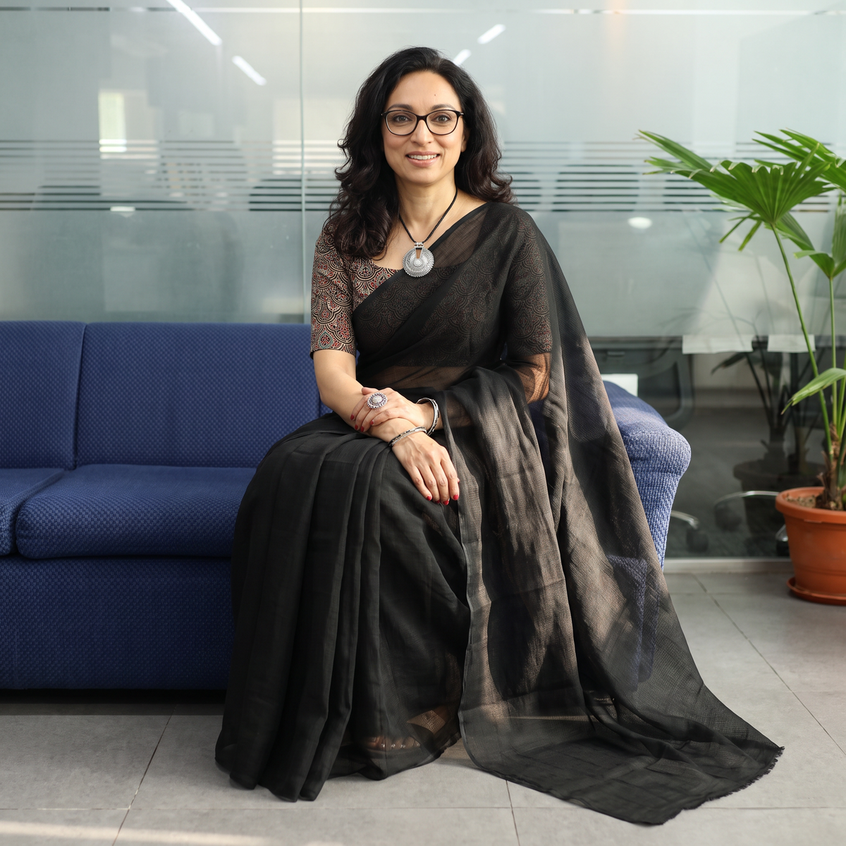 Black Nazaakat Kota Doria Cotton Plain Saree with Blouse & Jewellery Set, draped and worn by a woman, AI visual of the saree, iTokri