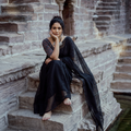 Black Nazaakat Kota Doria Cotton Plain Saree with Blouse & Jewellery Set, draped and worn by a woman, AI visual of the saree, iTokri