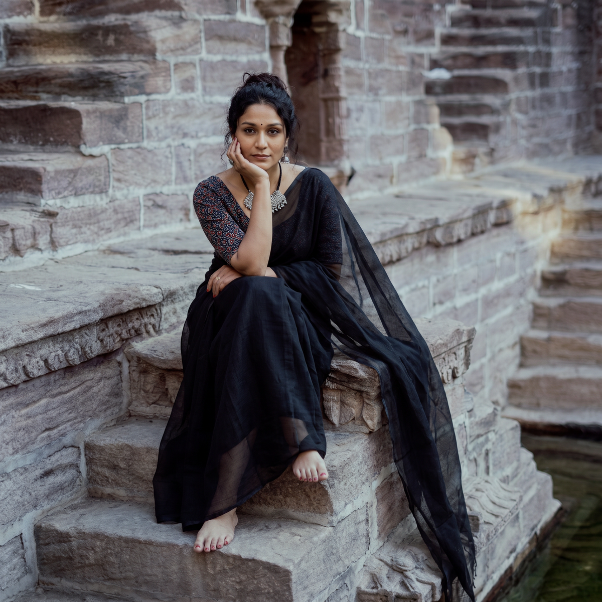 Black Nazaakat Kota Doria Cotton Plain Saree with Blouse & Jewellery Set, draped and worn by a woman, AI visual of the saree, iTokri