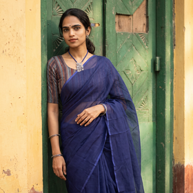 Blue Nazaakat Kota Doria Cotton Plain Saree with Blouse & Jewellery Set, draped and worn by a woman, AI visual of the saree, iTokri