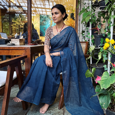 Blue Nazaakat Kota Doria Cotton Plain Saree with Blouse & Jewellery Set, draped and worn by a woman, AI visual of the saree, iTokri