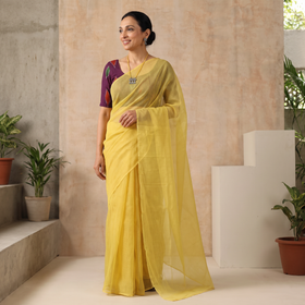 Yellow Nazaakat Kota Doria Cotton Plain Saree with Blouse & Jewellery Set, draped and worn by a woman, AI visual of the saree, iTokri