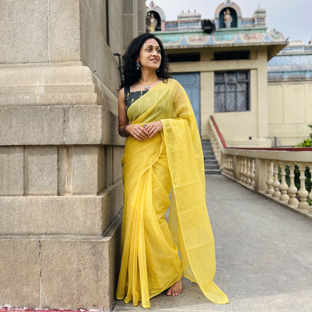Yellow Nazaakat Kota Doria Cotton Plain Saree with Blouse & Jewellery Set, draped and worn by a woman, AI visual of the saree, iTokri