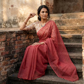 Red Nazaakat Kota Doria Cotton Plain Saree with Blouse & Jewellery Set, draped and worn by a woman, AI visual of the saree, iTokri
