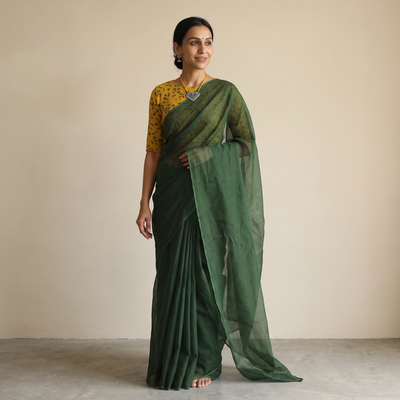 Green Nazaakat Kota Doria Cotton Plain Saree with Blouse & Jewellery Set, draped and worn by a woman, AI visual of the saree, iTokri