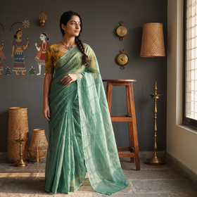 Green Nazaakat Kota Doria Cotton Plain Saree with Blouse & Jewellery Set, draped and worn by a woman, AI visual of the saree, iTokri