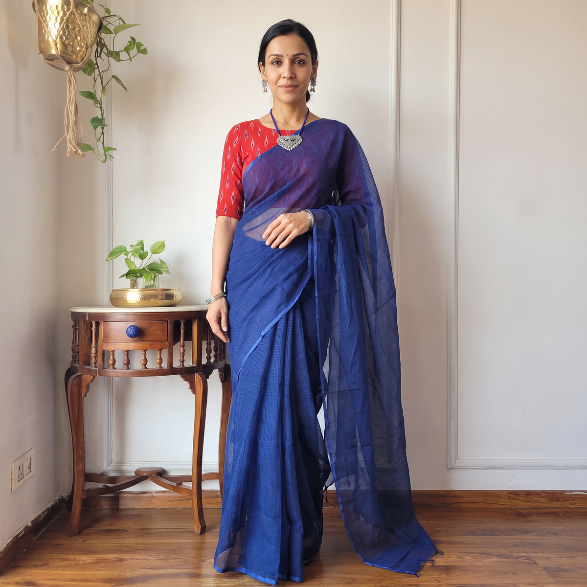 Blue Nazaakat Kota Doria Cotton Plain Saree with Blouse & Jewellery Set, draped and worn by a woman, AI visual of the saree, iTokri