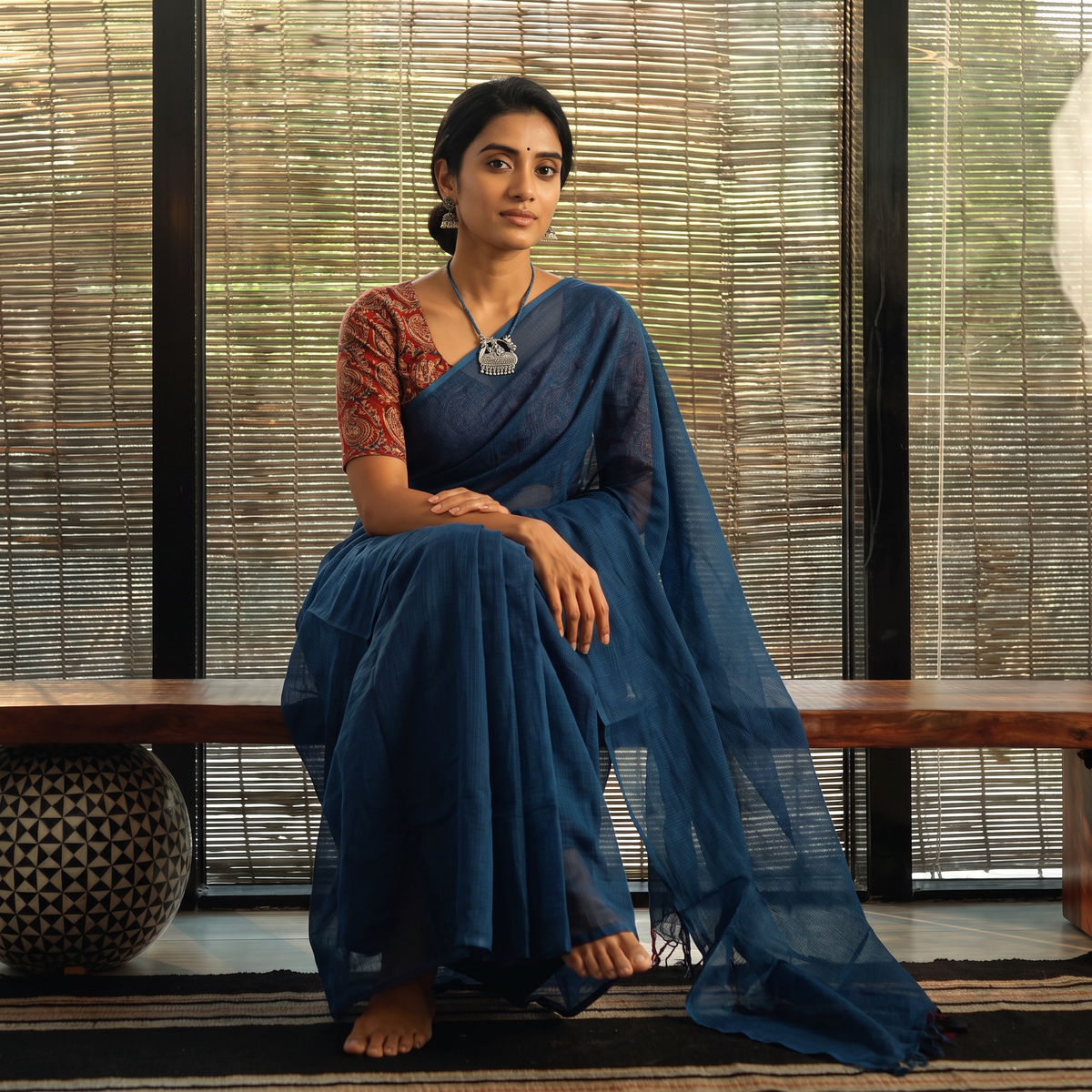 Blue Nazaakat Kota Doria Cotton Plain Saree with Blouse & Jewellery Set, draped and worn by a woman, AI visual of the saree, iTokri