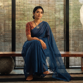 Blue Nazaakat Kota Doria Cotton Plain Saree with Blouse & Jewellery Set, draped and worn by a woman, AI visual of the saree, iTokri