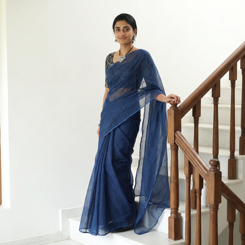 Blue Nazaakat Kota Doria Cotton Plain Saree with Blouse & Jewellery Set, draped and worn by a woman, AI visual of the saree, iTokri