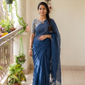 Blue Nazaakat Kota Doria Cotton Plain Saree with Blouse & Jewellery Set, draped and worn by a woman, AI visual of the saree, iTokri