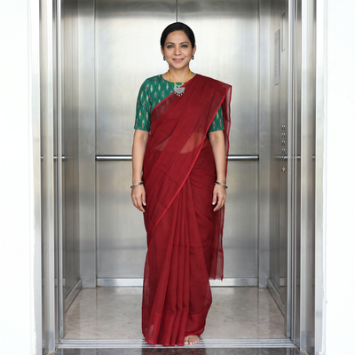 Red Nazaakat Kota Doria Cotton Plain Saree with Blouse & Jewellery Set, draped and worn by a woman, AI visual of the saree, iTokri