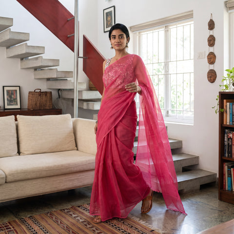 Pink Nazaakat Kota Doria Cotton Plain Saree with Blouse Piece & Earrings, draped and worn by a woman, AI visual of the saree, iTokri