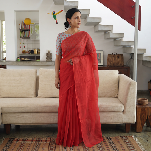 Red Nazaakat Kota Doria Cotton Plain Saree with Blouse Piece & Earrings, draped and worn by a woman, AI visual of the saree, iTokri