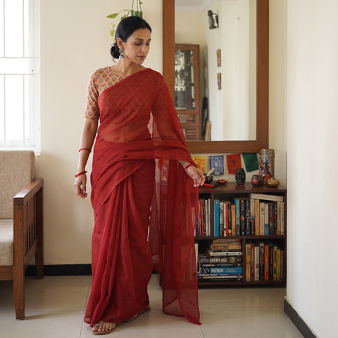 Maroon Nazaakat Kota Doria Cotton Plain Saree with Blouse Piece & Earrings, draped and worn by a woman, AI visual of the saree, iTokri