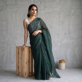 Green Nazaakat Kota Doria Cotton Plain Saree with Blouse Piece & Earrings, draped and worn by a woman, AI visual of the saree, iTokri