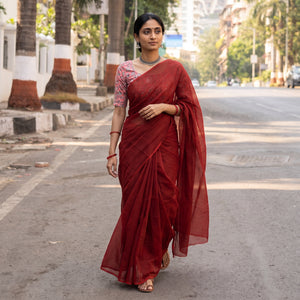 Maroon Nazaakat Kota Doria Cotton Plain Saree with Blouse Piece & Earrings, draped and worn by a woman, AI visual of the saree, iTokri