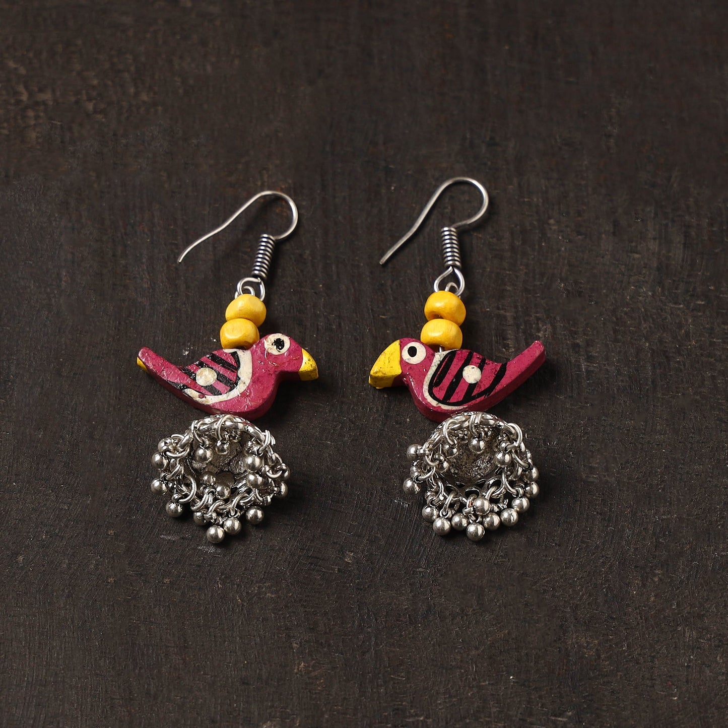 Noor german silver jhumki earrings with wooden bird