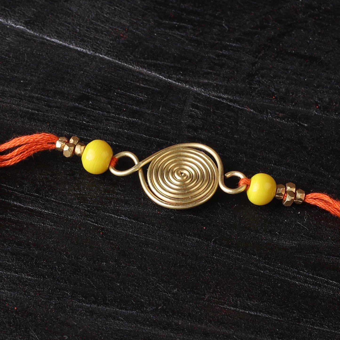 Handcrafted tribal dokra brass thread rakhi 12