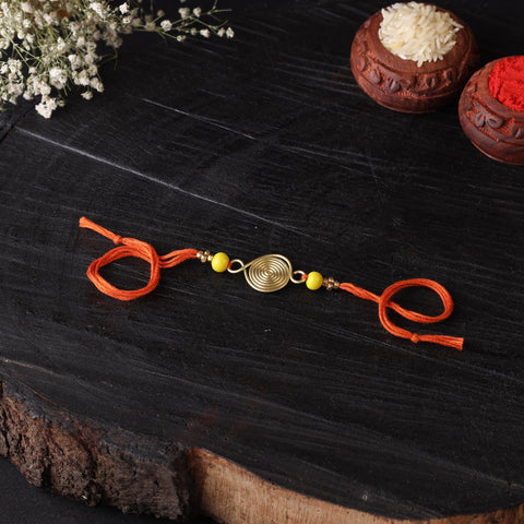 Handcrafted tribal dokra brass thread rakhi 12