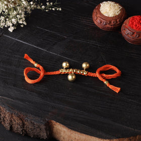 Handcrafted tribal dokra brass thread rakhi 29