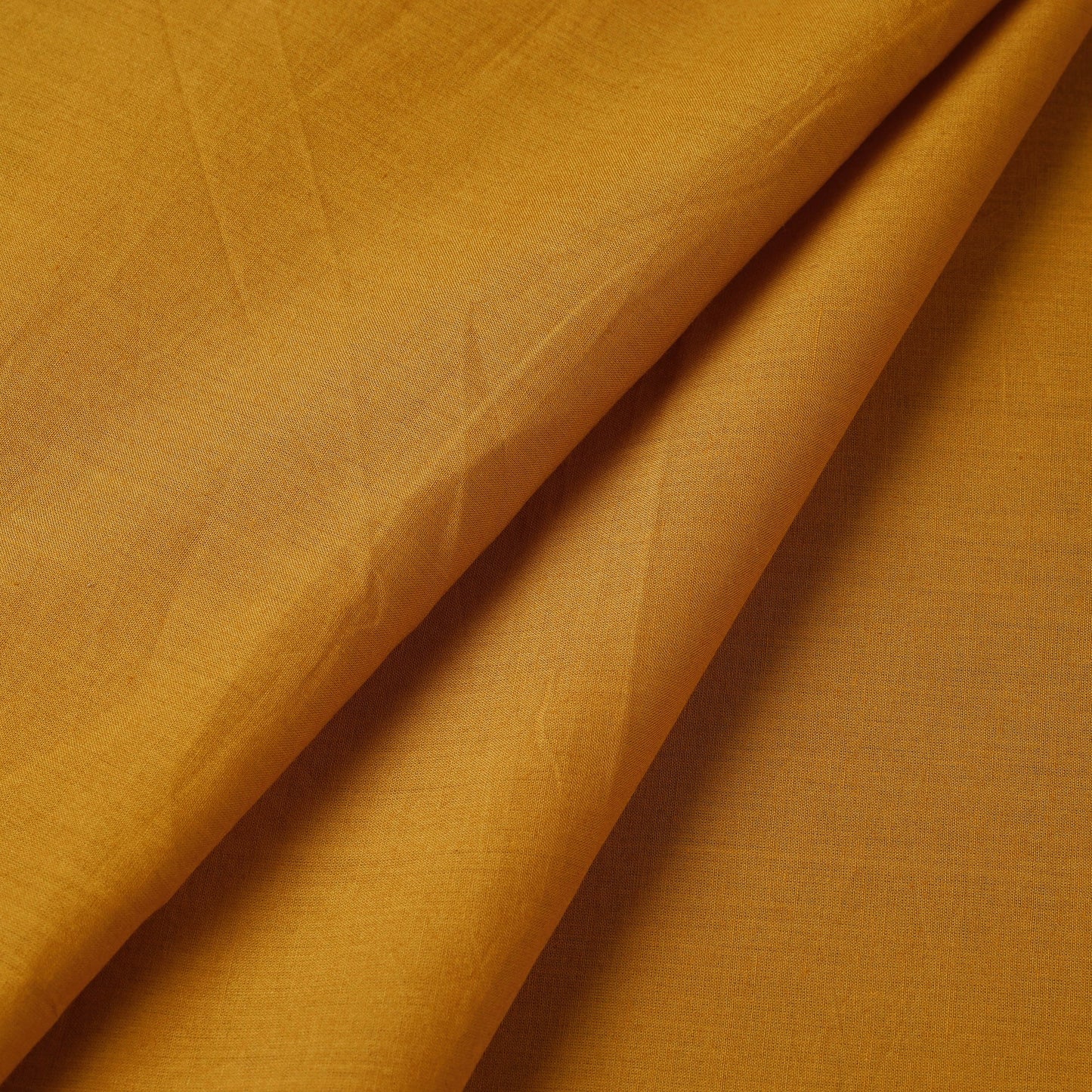 Buy Orange Prewashed Plain Cotton Fabric