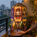 Pattachitra Handpainted Palm Leaf Lampshade from Odisha, lit in a home in the evening, AI visual of the light, iTokri