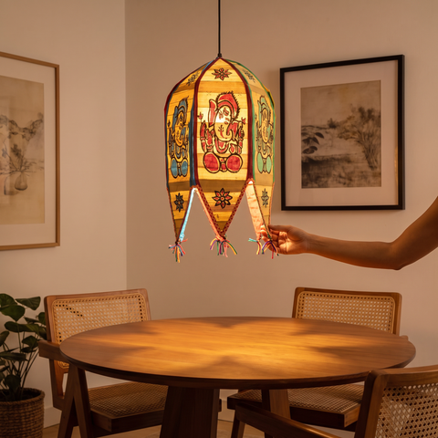 Pattachitra Handpainted Palm Leaf Lampshade from Odisha, lit in a home in the evening, AI visual of the light, iTokri