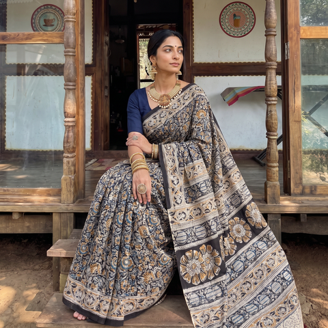 Black Pedana Block Print Cotton Kalamkari Saree, draped and worn by a woman, AI visual of the saree, iTokri