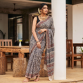 Black Pedana Block Print Cotton Kalamkari Saree, draped and worn by a woman, AI visual of the saree, iTokri