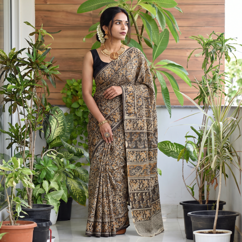 Green Pedana Hand Block Print Natural Dyed Cotton Kalamkari Saree, draped and worn by a woman, AI visual of the saree, iTokri