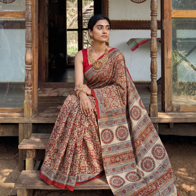 Red Pedana Hand Block Print Natural Dyed Cotton Kalamkari Saree, draped and worn by a woman, AI visual of the saree, iTokri