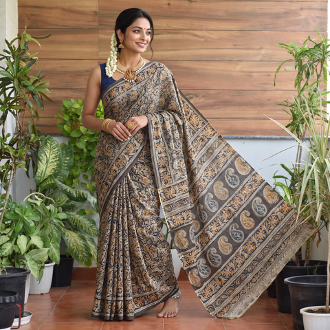 Green Pedana Hand Block Print Natural Dyed Cotton Kalamkari Saree, draped and worn by a woman, AI visual of the saree, iTokri