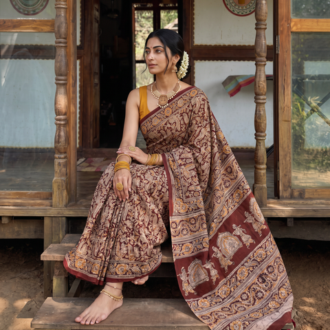 Maroon Pedana Hand Block Print Natural Dyed Cotton Kalamkari Saree, draped and worn by a woman, AI visual of the saree, iTokri