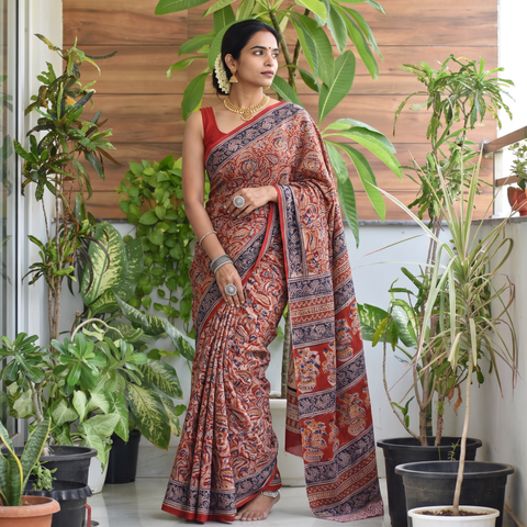 Red Pedana Hand Block Print Natural Dyed Cotton Kalamkari Saree, draped and worn by a woman, AI visual of the saree, iTokri