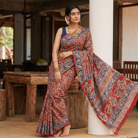 Red Pedana Hand Block Print Natural Dyed Cotton Kalamkari Saree, draped and worn by a woman, AI visual of the saree, iTokri