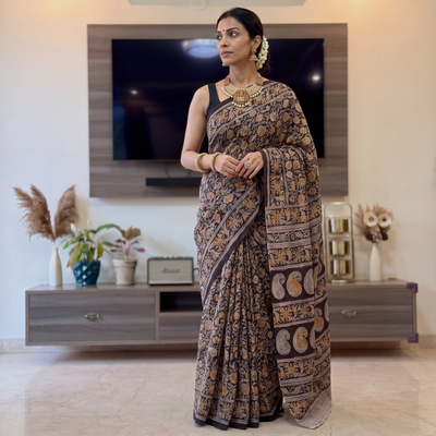 Black Pedana Hand Block Print Natural Dyed Cotton Kalamkari Saree, draped and worn by a woman, AI visual of the saree, iTokri