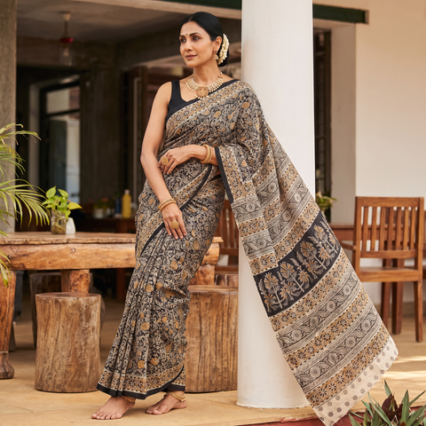 Black Pedana Hand Block Print Natural Dyed Cotton Kalamkari Saree, draped and worn by a woman, AI visual of the saree, iTokri