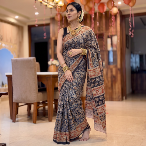 Black Pedana Hand Block Print Natural Dyed Cotton Kalamkari Saree, draped and worn by a woman, AI visual of the saree, iTokri