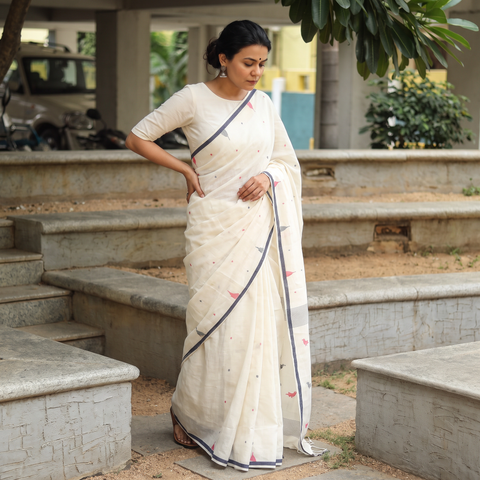 White Phulia Jamdani Handloom Cotton Saree with Tassels, draped and worn by a woman, AI visual of the saree, iTokri