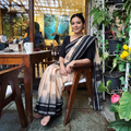 Beige Phulia Jamdani Pure Handloom Cotton Saree with Tassels (Count 84/40), draped and worn by a woman, AI visual of the saree, iTokri