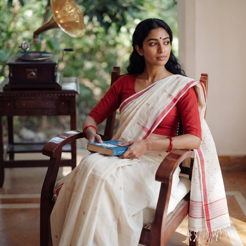 White Phulia Jamdani Pure Handloom Cotton Saree with Tassels (Count 92/40), draped and worn by a woman, AI visual of the saree, iTokri